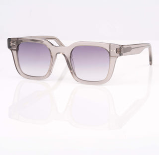Sunglasses with a transparent frame and purple gradient lenses on a white background