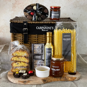 carpaninis wicker hamper with chocolates sauce cantucci chocolate bar olive oil honey and pasta in brown