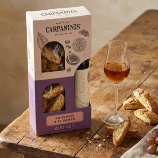 A gift set of vin santo and cantucci on a table 