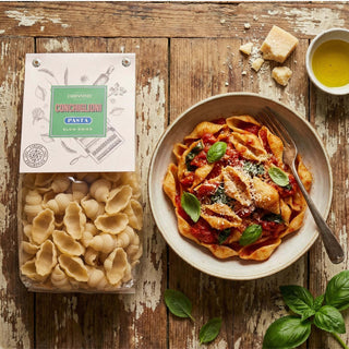 A packet of Carpaninis pasta next to a prepared dish