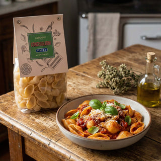 A packet of pasta next to a prepared dish