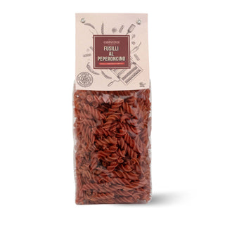 Packaged chilli fusilli pasta with a decorative label on a white background