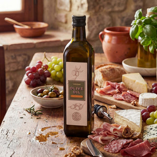 A bottle of olive oil on a wooden table with cheese and meats