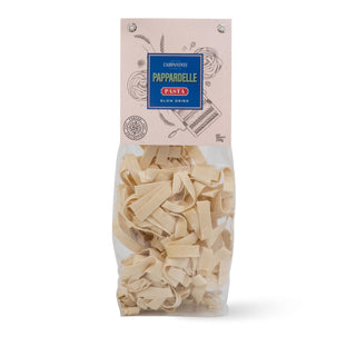 Package of Carpianinis Pappardelle pasta on a white background