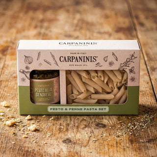 A pesto and penne set. byCarpaninis on a wooden table