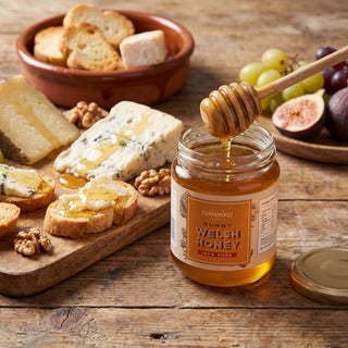 A jar of Carpaninis Welsh runny honey opened with cheese
