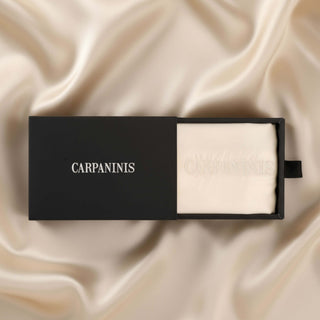 A Carpaninis chapagne colour silk pillowcase