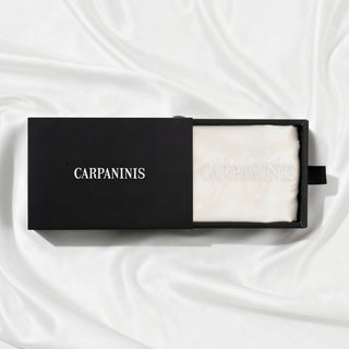 A Carpaninis white silk pillowcase