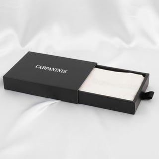 A Carpaninis white silk pillowcase