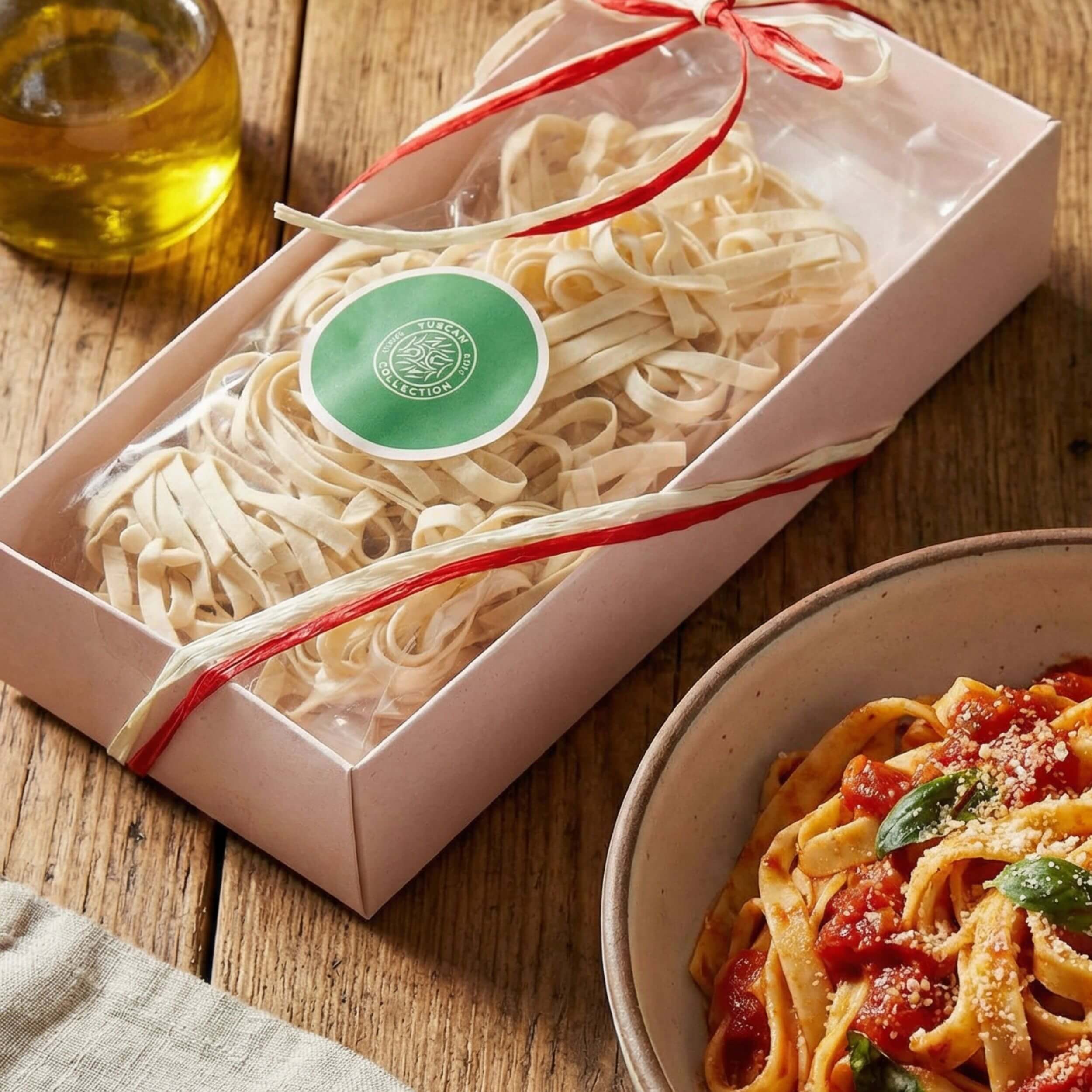 A gift box of Carpaninis tagliatelle pasta. ona wooden table