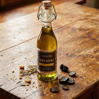 A bottle of Carpaninis truffle oil on a wooden table