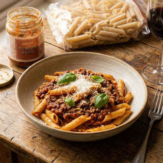 A gift pack of penne and Tuscan ragu sauce on a table 