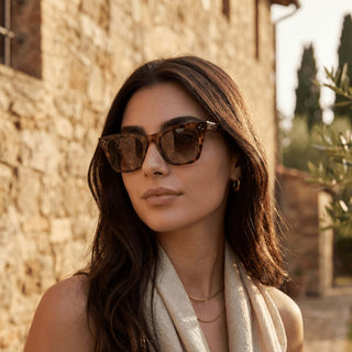 A woman in Tuscany wearing a pair of Carpaninis tortoise sunglasses