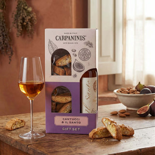 A gift set of Carpaninis vin santo and cantucci on a wooden table