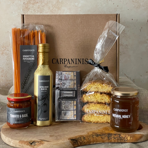 carpaninis gift box containing chilli spaghetti sauce olive oil chocolate bar cantucci biscuits and welsh honey