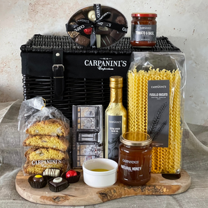 carpaninis wicker hamper with chocolates sauce cantucci chocolate bar olive oil honey and pasta in black